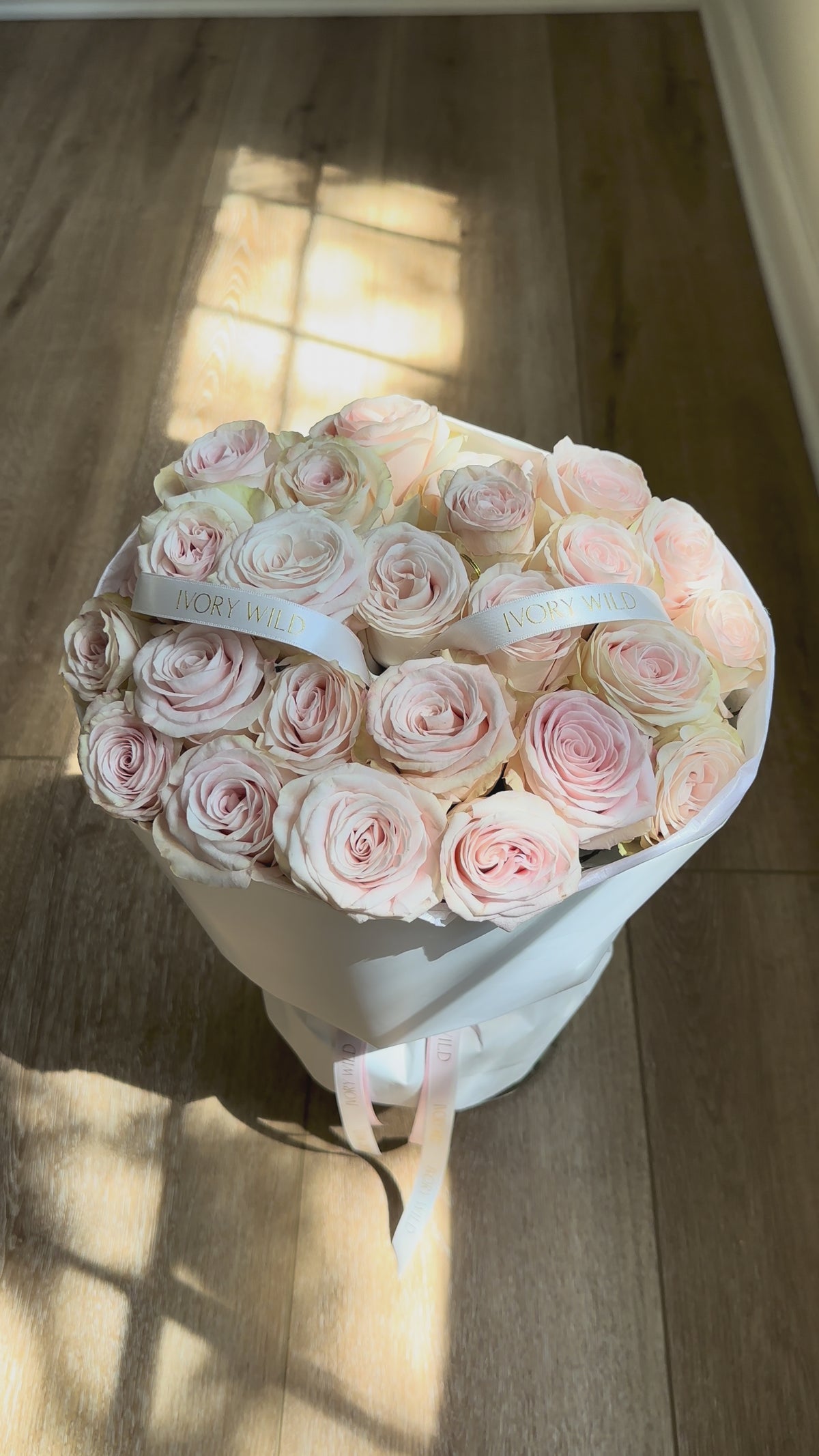 Large Soft Blush bouquet of pale blush and cream roses with branded ribbons by Ivory Wild, Austin florist.