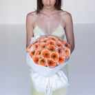 Handcrafted orange garden rose bouquet by Ivory Wild Austin florist