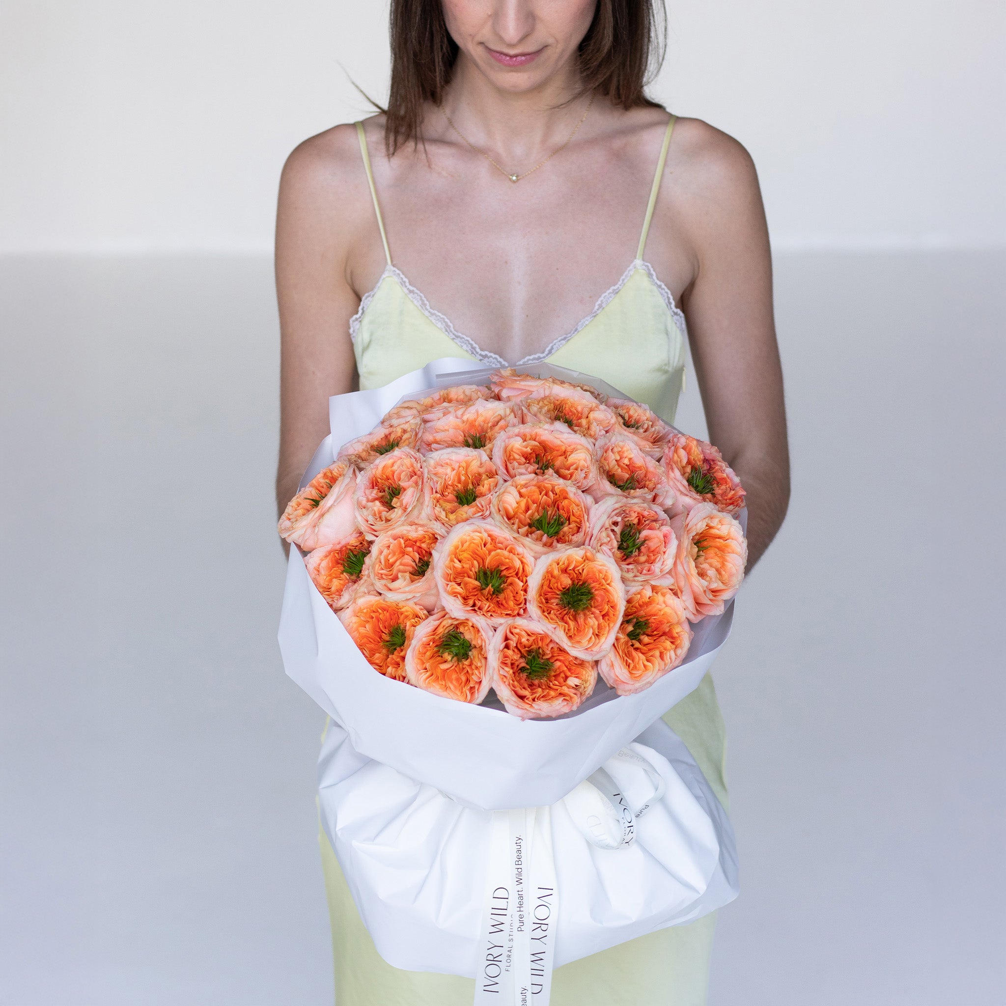 Handcrafted orange garden rose bouquet by Ivory Wild Austin florist