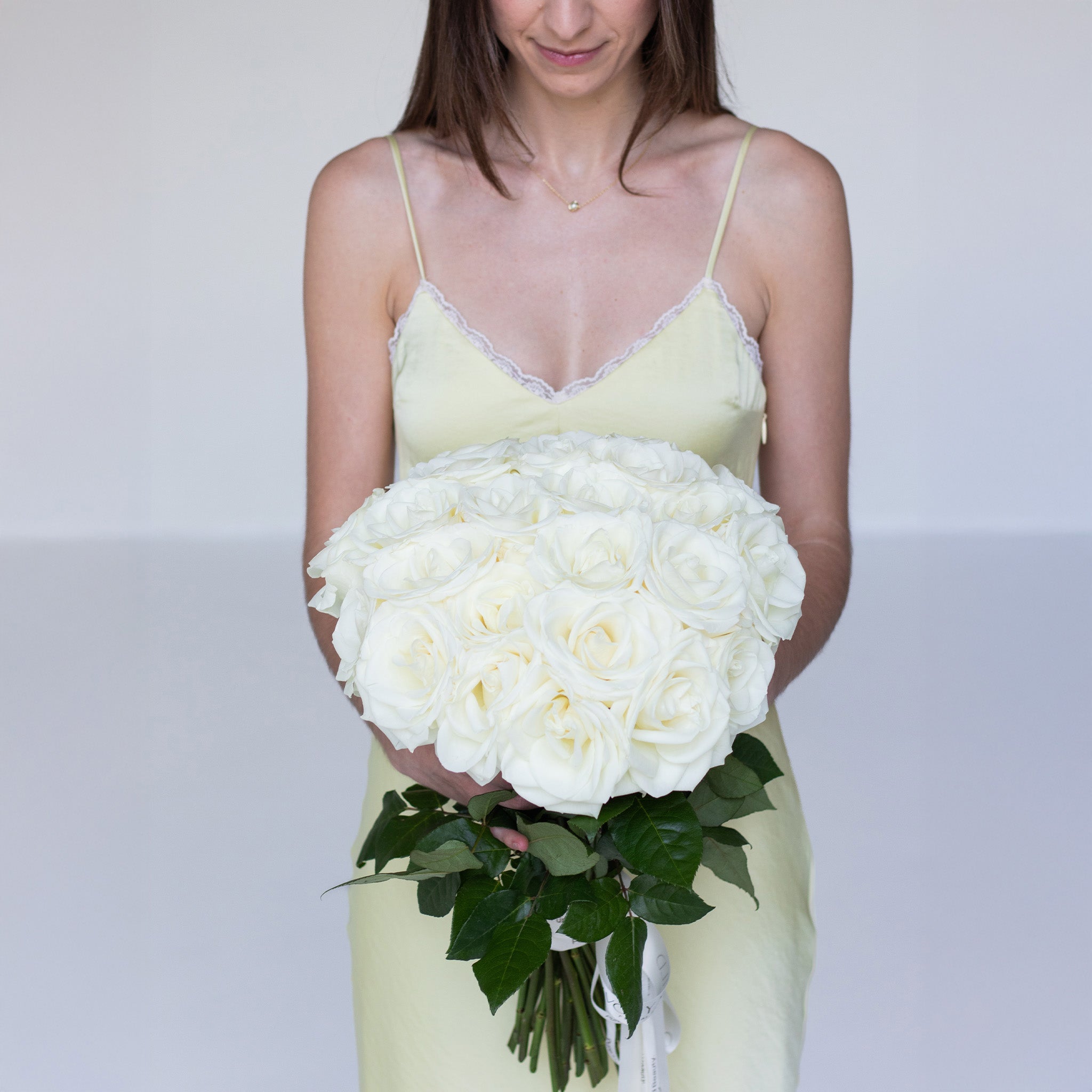Handcrafted white rose bouquet by Ivory Wild Austin florist